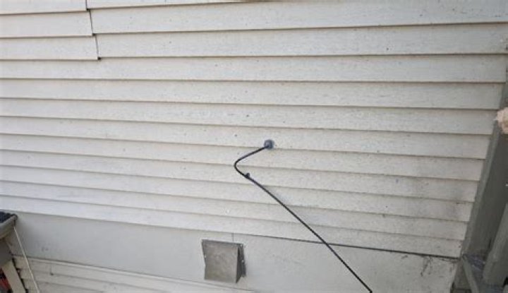 Can I run wire behind siding